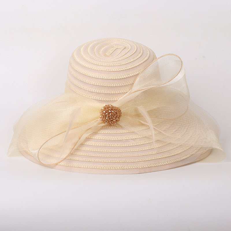 Big brim ladies comfortable sunshade hat with bow, made from papyrus and polyester.