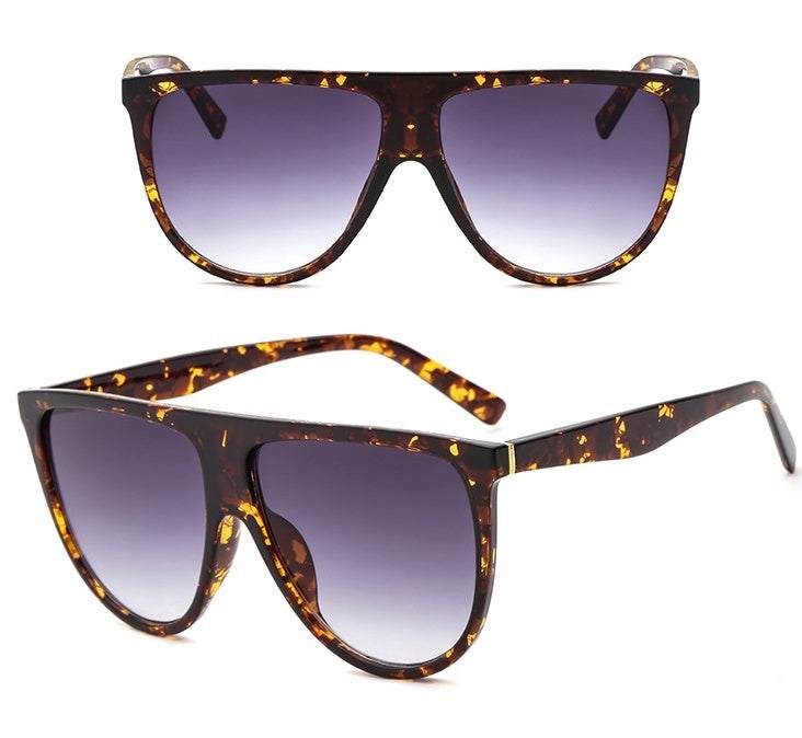 Women's full-frame sunglasses with gradient lenses and tortoiseshell finish for UV protection.