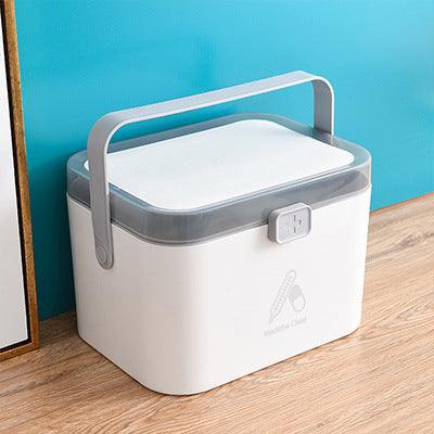Portable double-layer first aid medicine box with handle in Nordic design.
