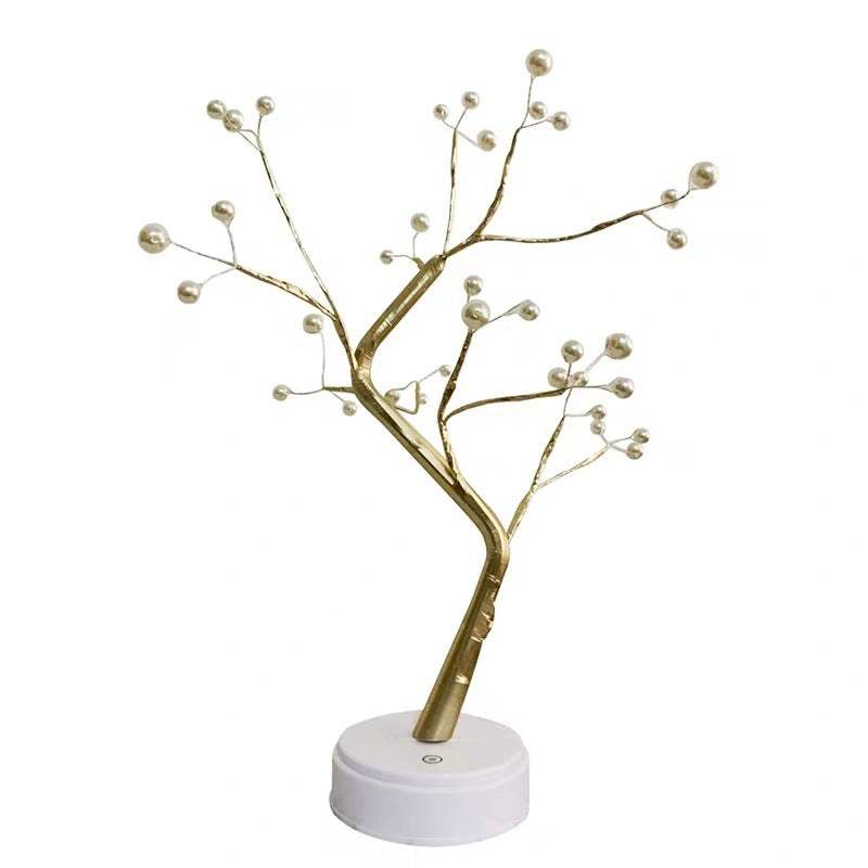 LED copper wire light shaped like a golden tree with pearl-like bulbs on a white base for bedroom decoration