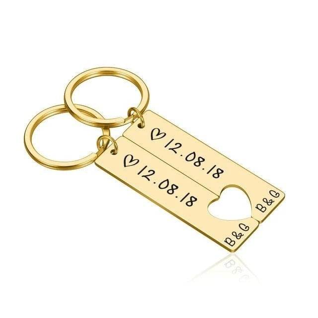 Customized couples keychain with personal engraving in gold.