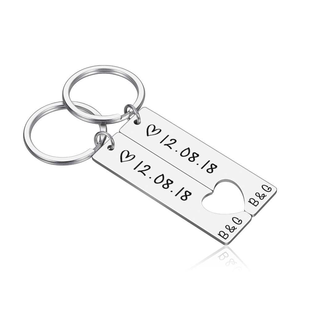 Customized couples keychain with engraved date and heart cutout, perfect for anniversaries.