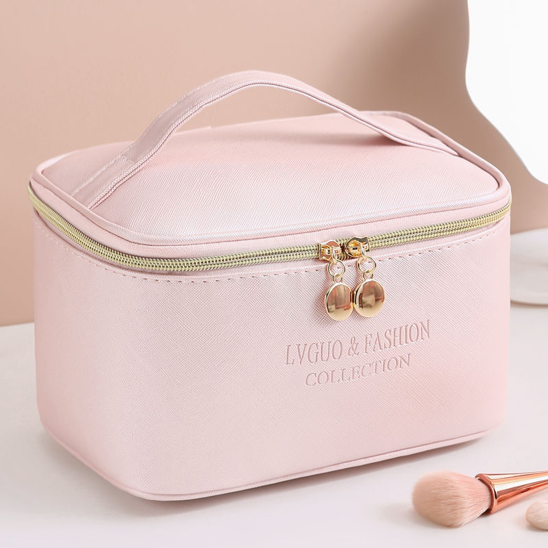 Medium-sized waterproof storage bag with zipper closure in solid color PU leather, ideal for travel and cosmetic storage.