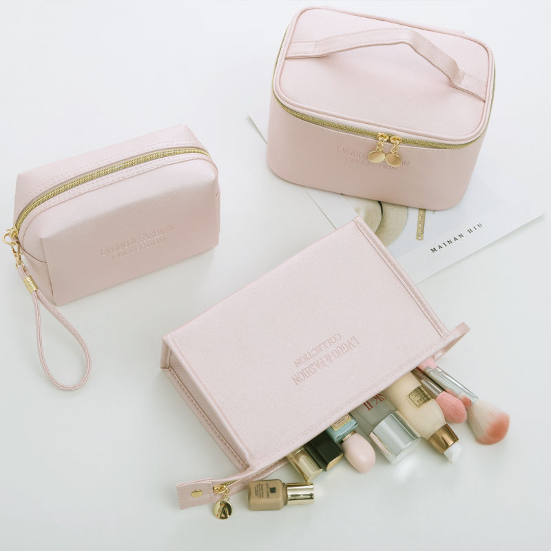 Medium-sized PU leather waterproof storage bag set for travel and makeup, featuring solid color and zipper pockets.
