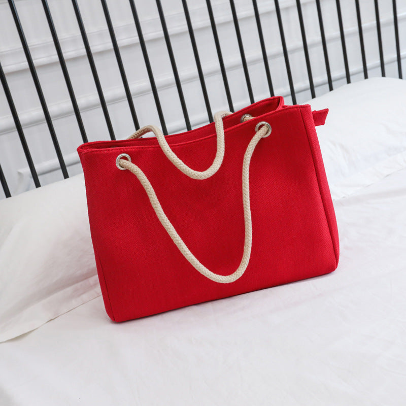 Large capacity Korean style women's cotton shoulder bag in red.