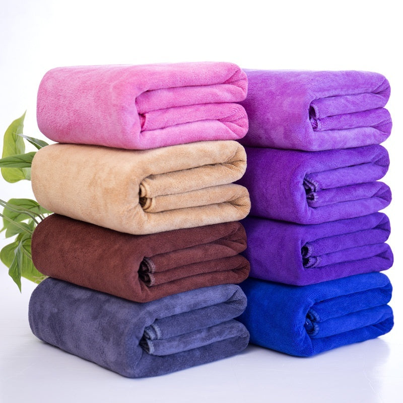 Microfiber thickened car wash cleaning towels in assorted colors stacked neatly.