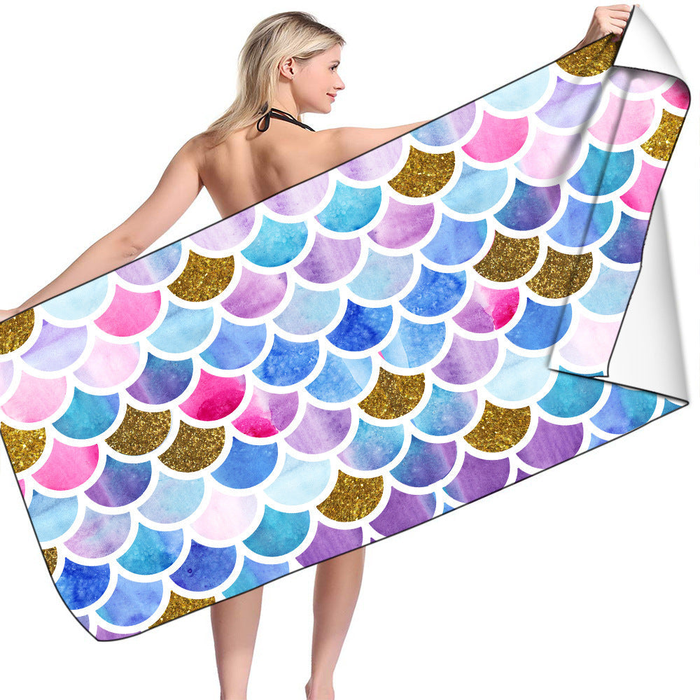 Microfiber bath towel with colorful mermaid scale pattern.