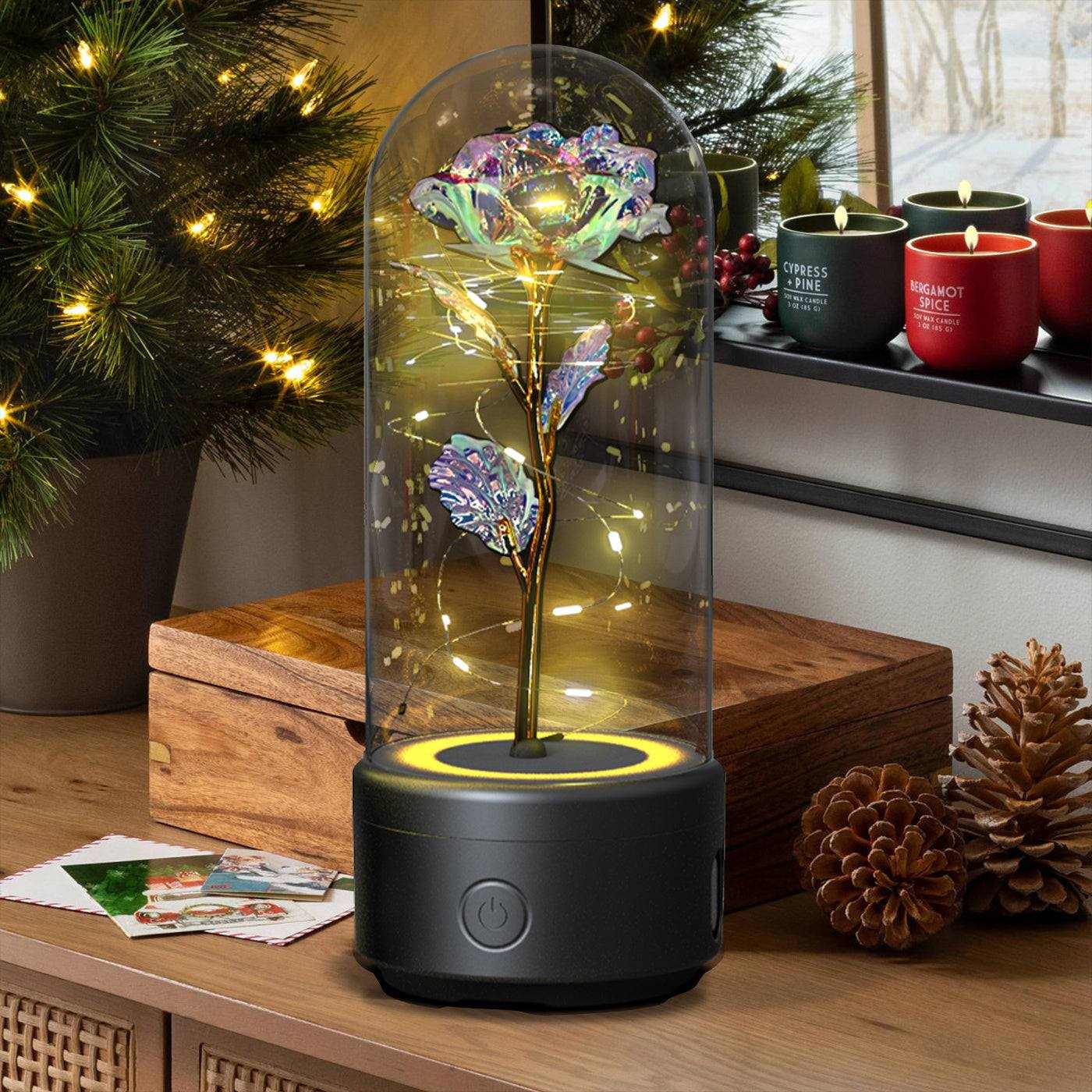 Creative 2 in 1 rose flower LED light and Bluetooth speaker under glass cover on wooden table with holiday decor background