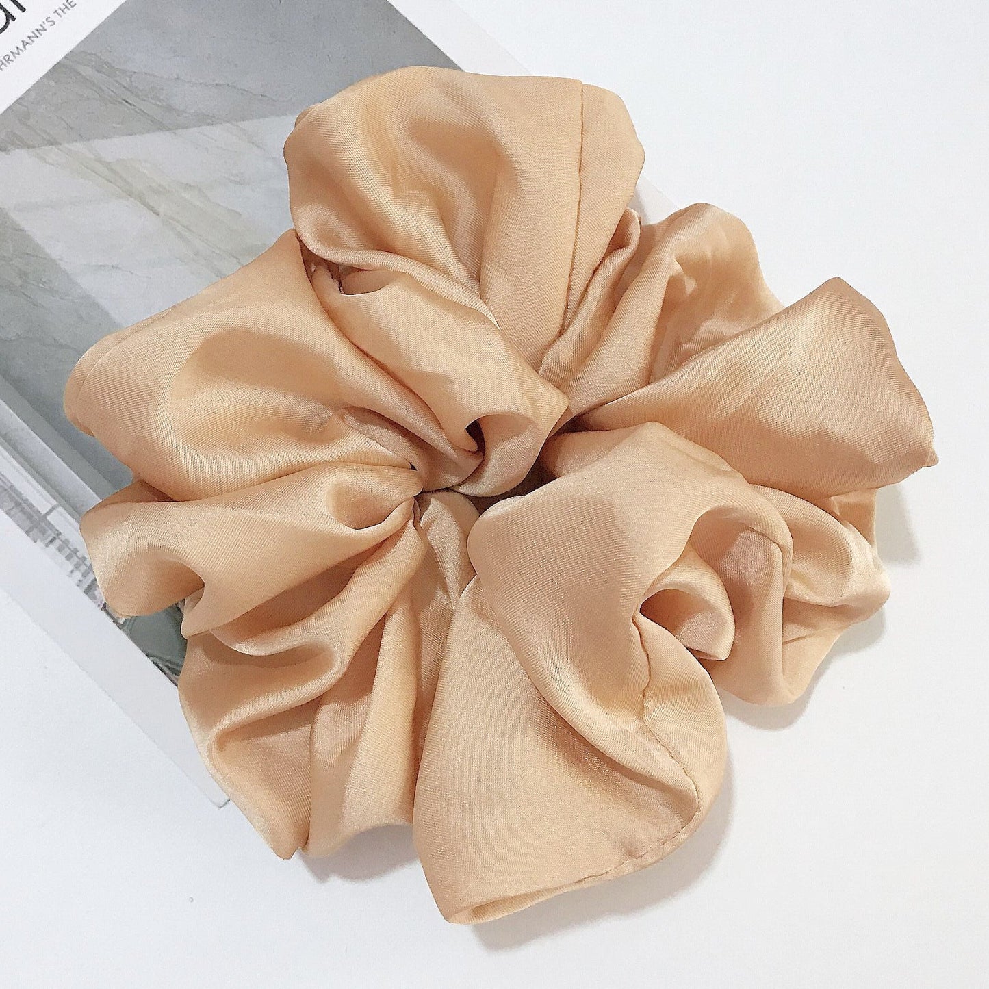 Oversized smooth satin large intestine circle hair tie in champagne color, handmade with cloth material.