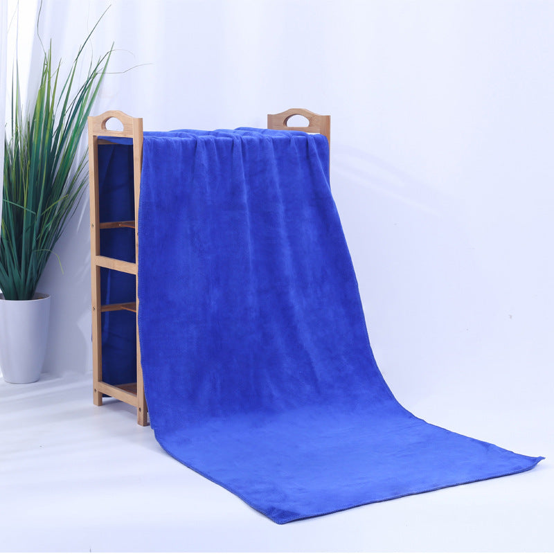Microfiber thickened car wash cleaning towel in dark blue on display stand.
