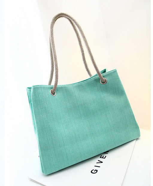 Korean style large capacity linen shoulder bag with soft cotton fabric, plain design, and woven elements.