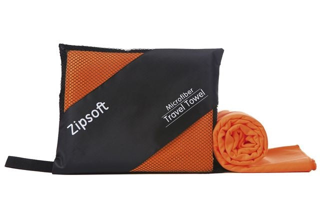 Orange microfiber exercise towel with black carrying pouch, labeled "Zipsoft".