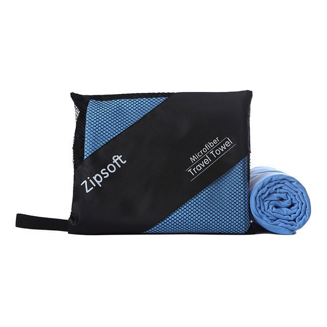 Exercise towel made of superfine polyester fiber, displayed rolled and partially unrolled.