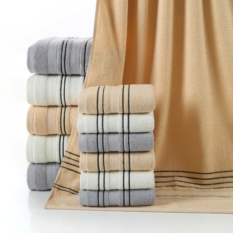 Household pure cotton towels in various colors stacked neatly.