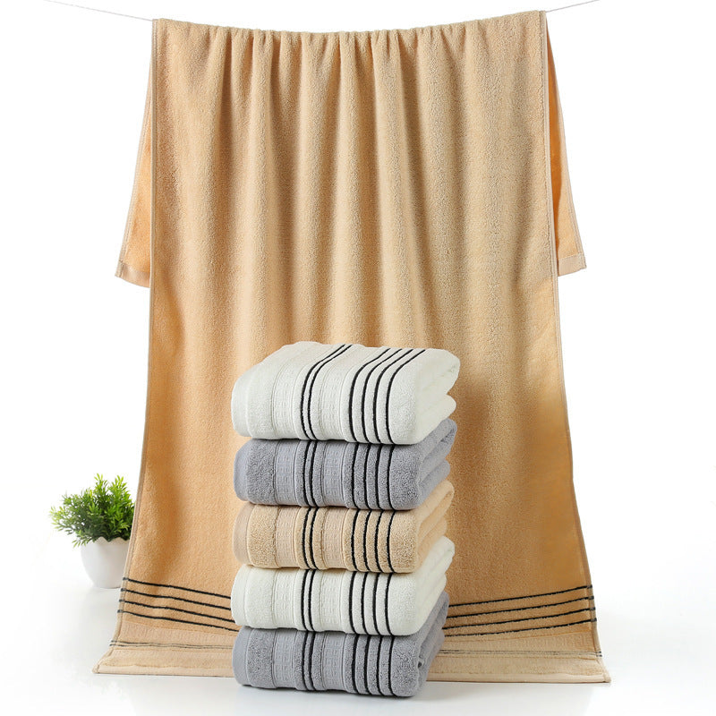 Household pure cotton towels set in white, gray, and khaki colors with a large bath towel background.