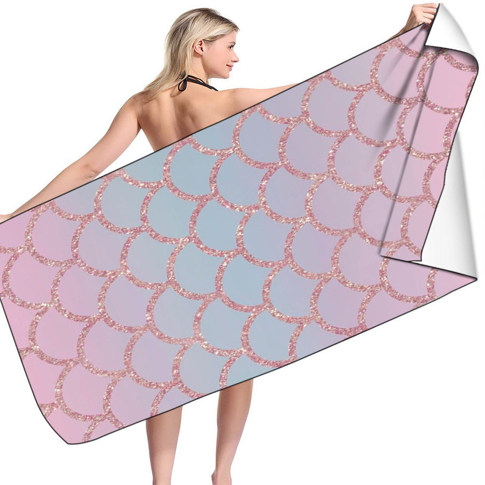 Microfiber bath towel with mermaid-scale design in pastel colors.