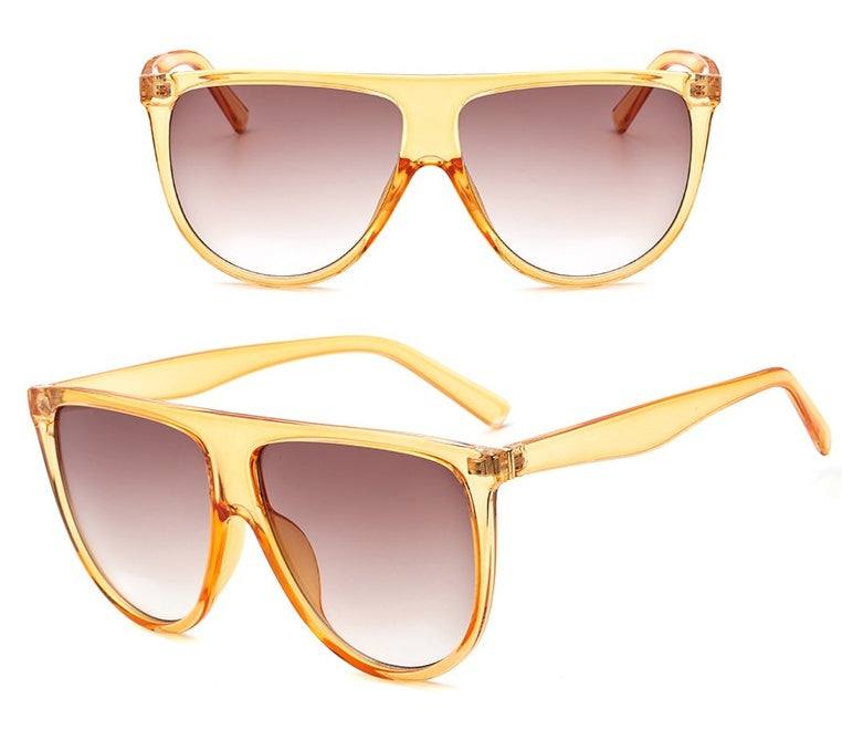 Sunglasses with gradient lenses for women, featuring full-frame design and UV protection, ideal for shopping and driving.