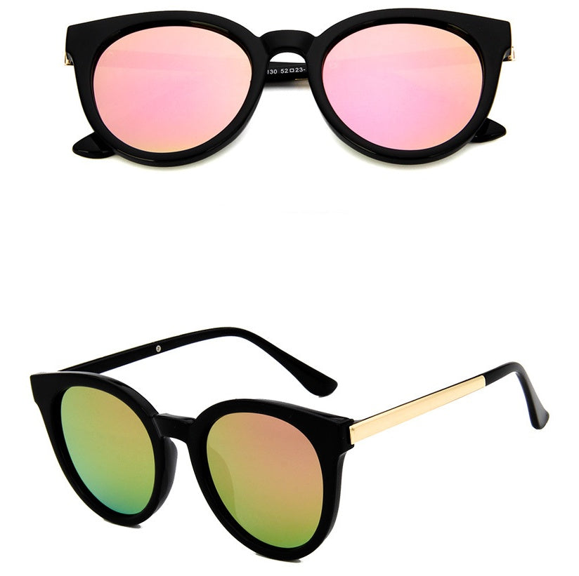 Pink cat eye sunglasses for women with vintage style and mirror lenses.