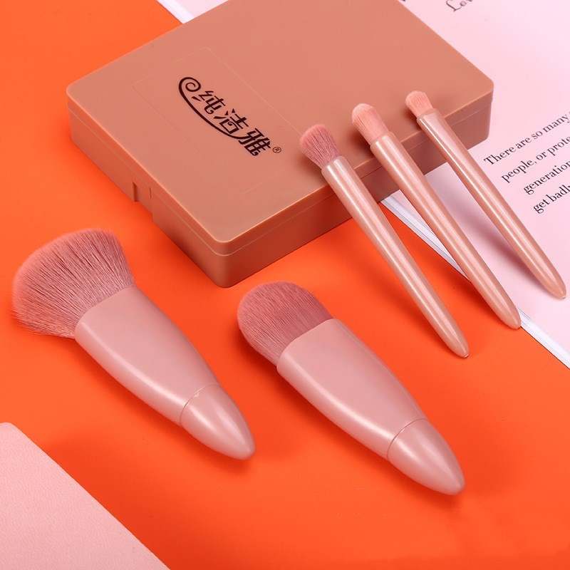 5-piece makeup brushes set with soft pink synthetic bristles and portable case.