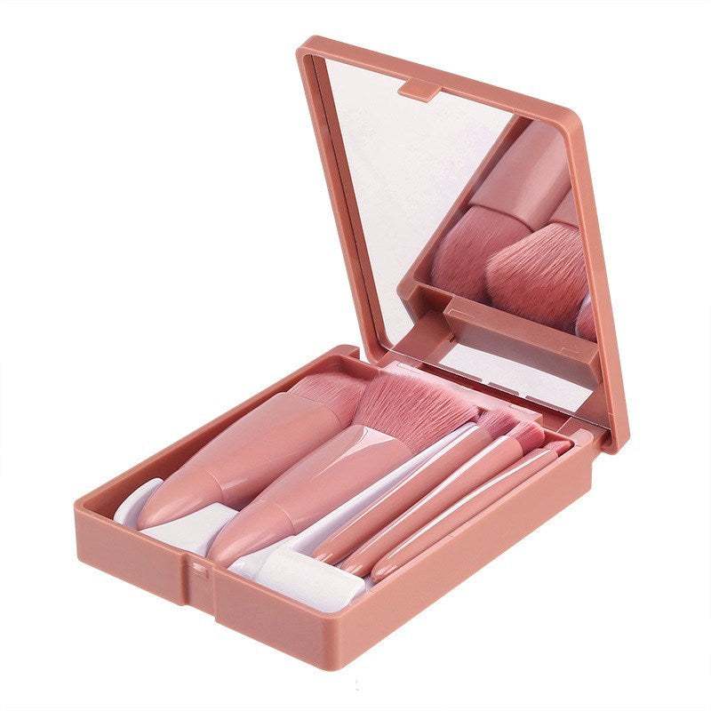 Portable 5-piece makeup brush set with pink case and mirror, featuring cruelty-free synthetic bristles for powder, blush, foundation, and eye shadow.