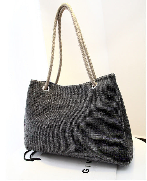 Large capacity Korean style cotton shoulder bag with woven texture and soft handles.
