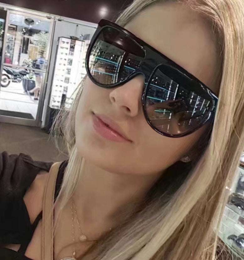 Sunglasses for women with gradient lenses, full-frame design, offering UV protection.