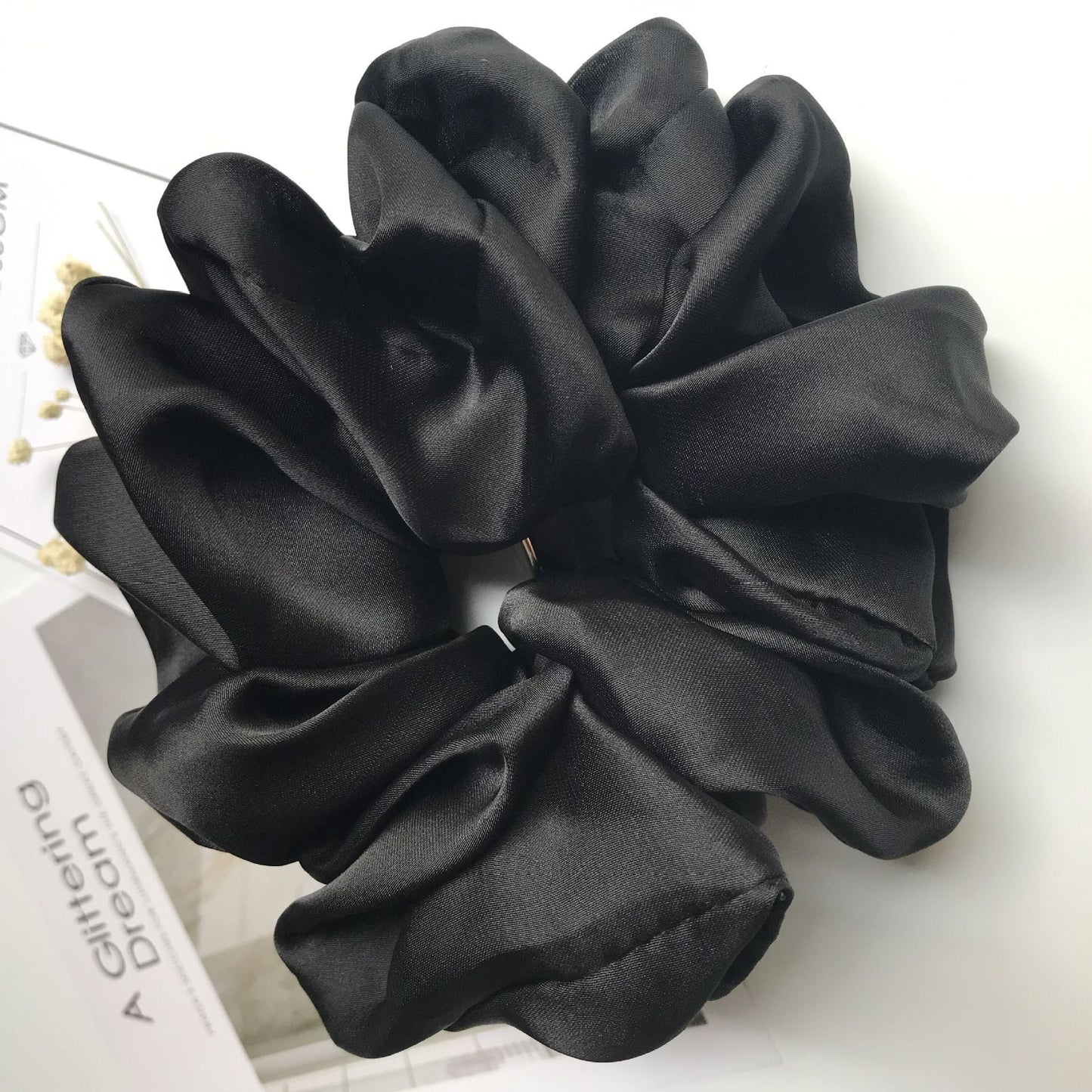 Oversized smooth satin black hair tie for women.
