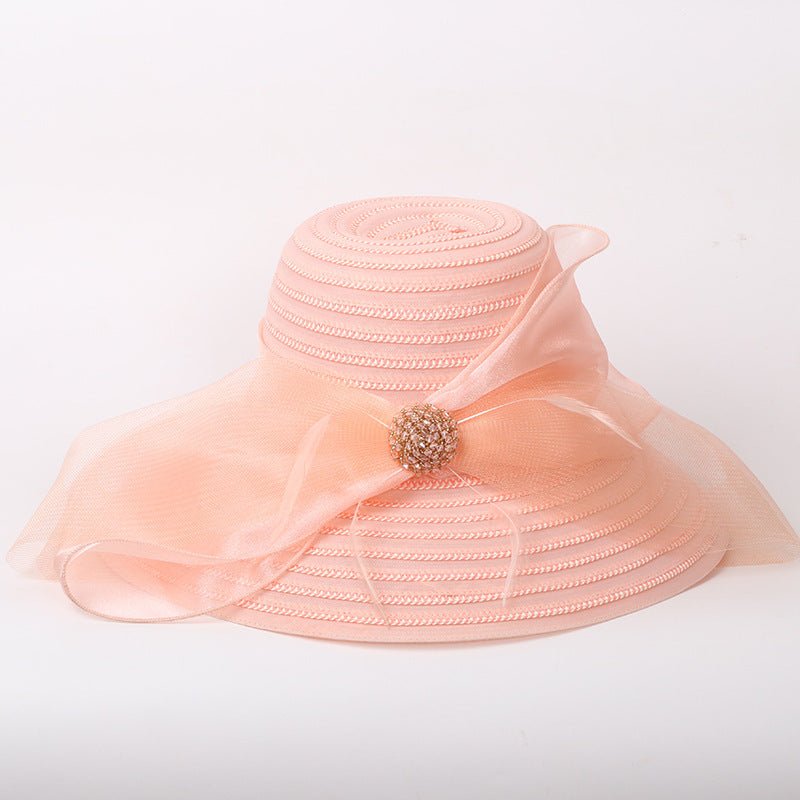 Big brim ladies comfortable light sunshade hat with bow accent.