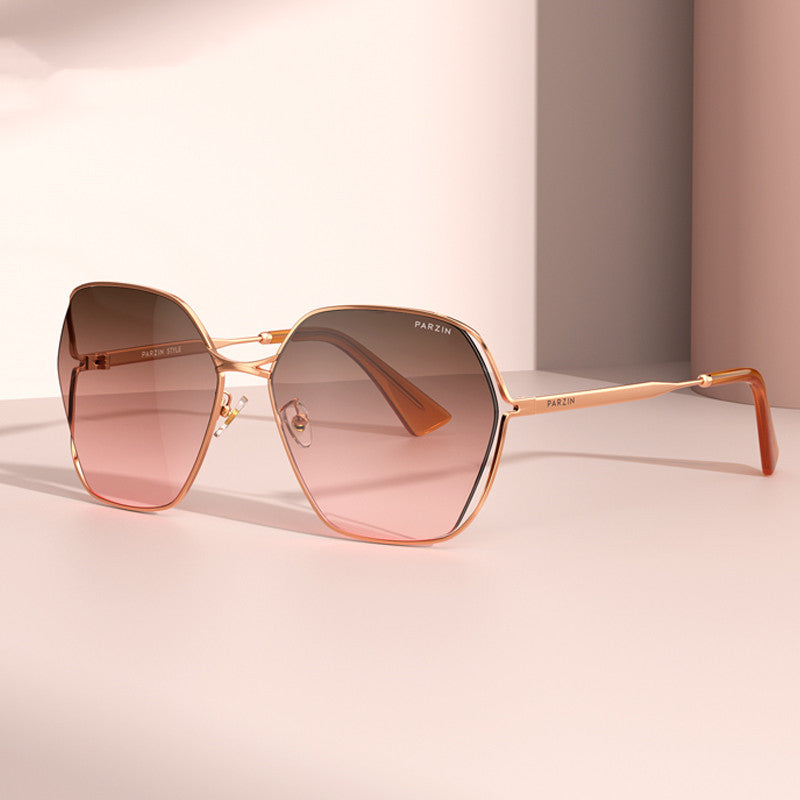 Elegant women's fashion gradient shades with metal frame and nylon lenses, featuring a gradual reddish-brown tint.