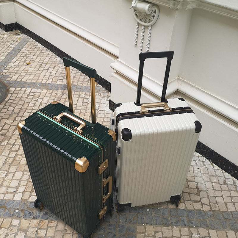 Aluminum alloy frame suitcase with universal wheels and anti-theft lock, shown in green and white on patterned floor.