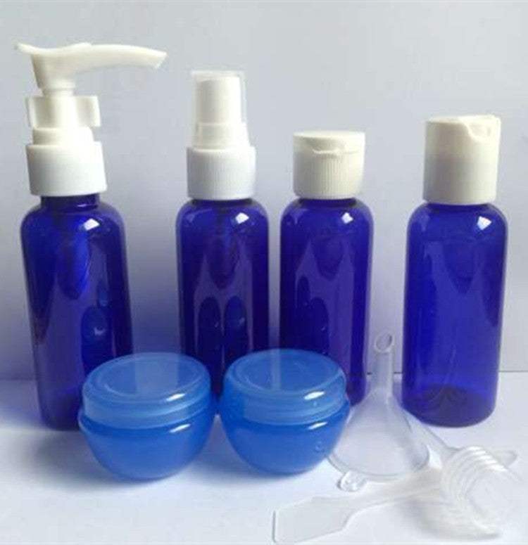 Cosmetic Bottling Set with blue plastic bottles and containers for lotions, shampoos, and creams.