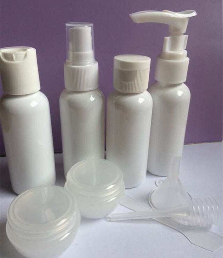 Cosmetic bottling set featuring white PET plastic bottles with various dispensers for lotions, shampoos, and creams.