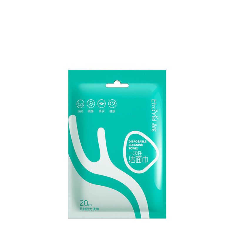 Disposable compression towel package with teal design, showcasing travel-friendly features.