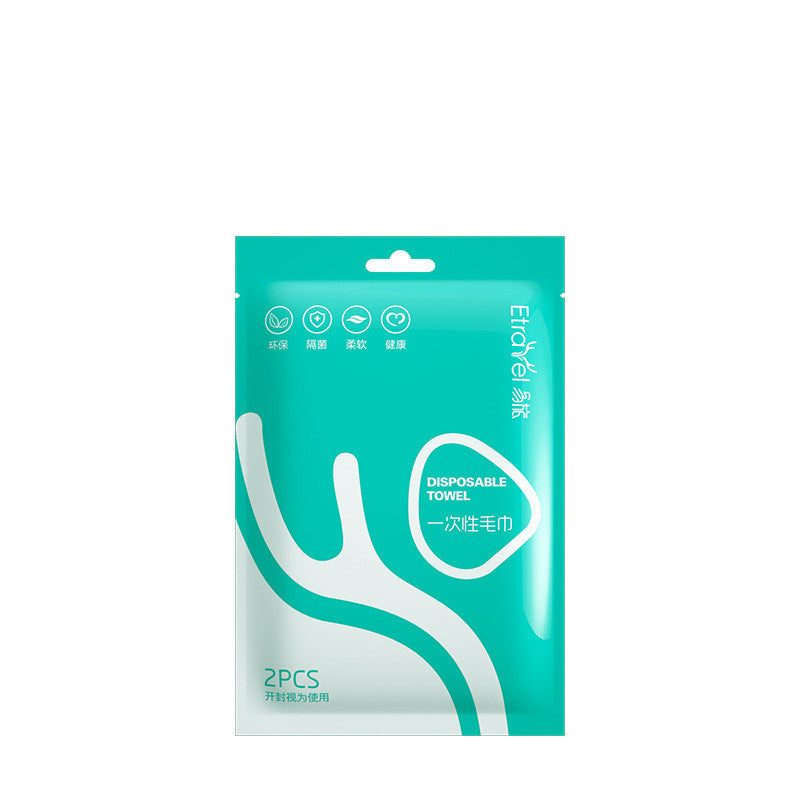 Disposable compression towel in green packaging with white text and graphics.