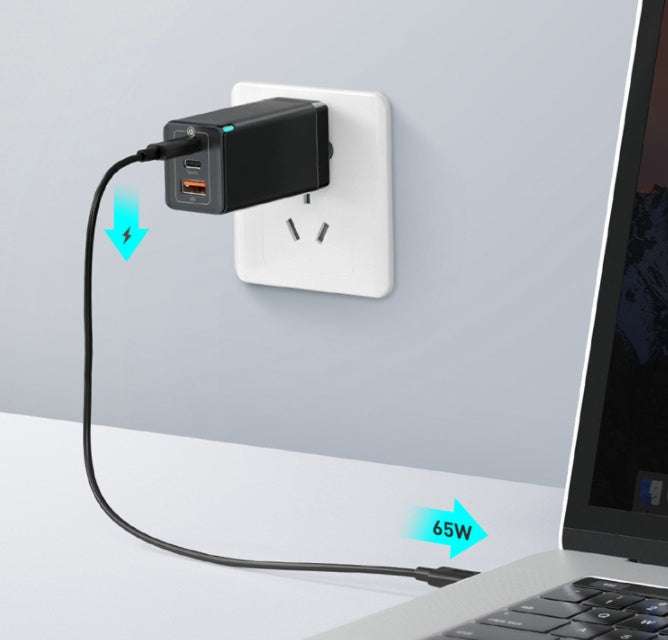 Fast mobile phone charger with three ports plugged into wall, connecting to a laptop.