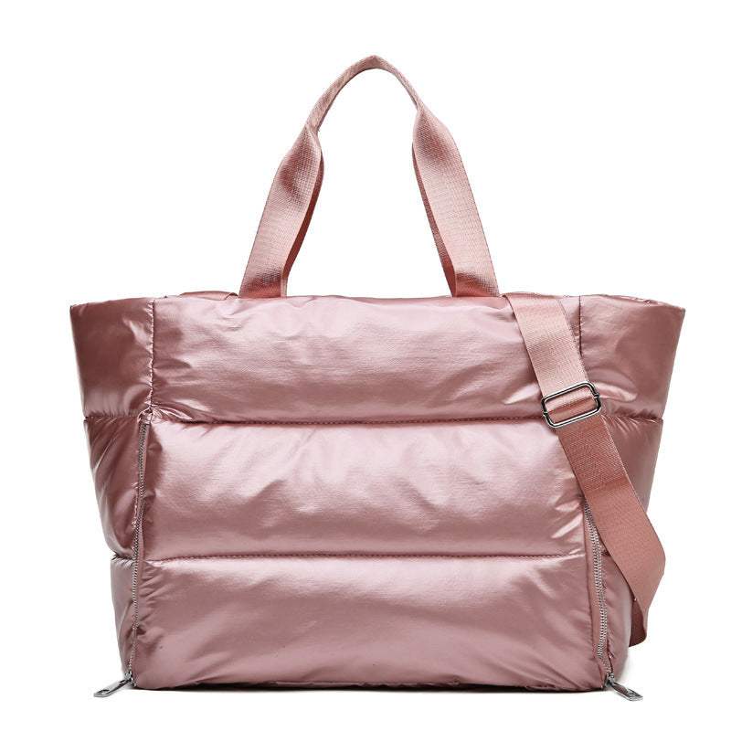 Women's gym bag in durable pink nylon fabric with a cross-body strap.