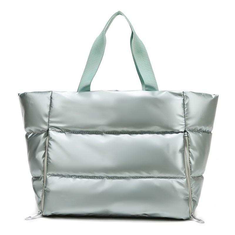 Durable nylon women's gym bag with soft handles, versatile for leisure, fitness, and travel.