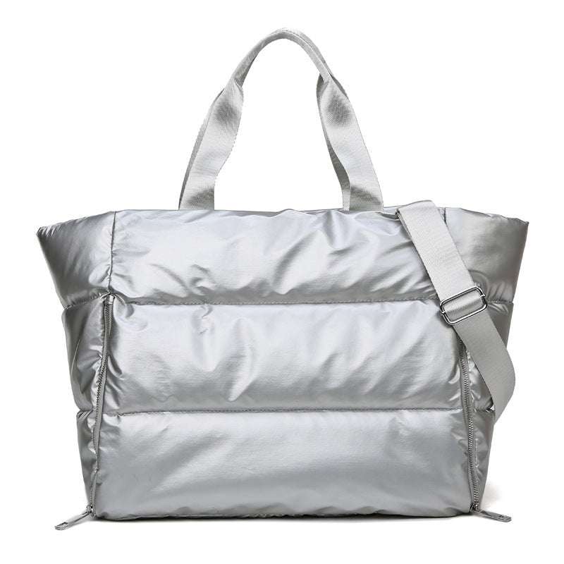 Women's durable nylon gym bag with single handle, silver color, versatile for fitness and travel.