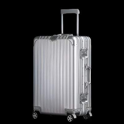 Aluminum magnesium alloy luggage set with universal wheels in sleek silver finish.