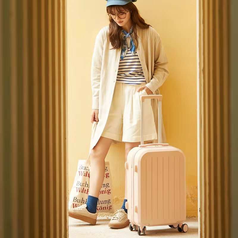 Candy color trolley suitcase with universal wheels and soft carry handle, ideal for female students.