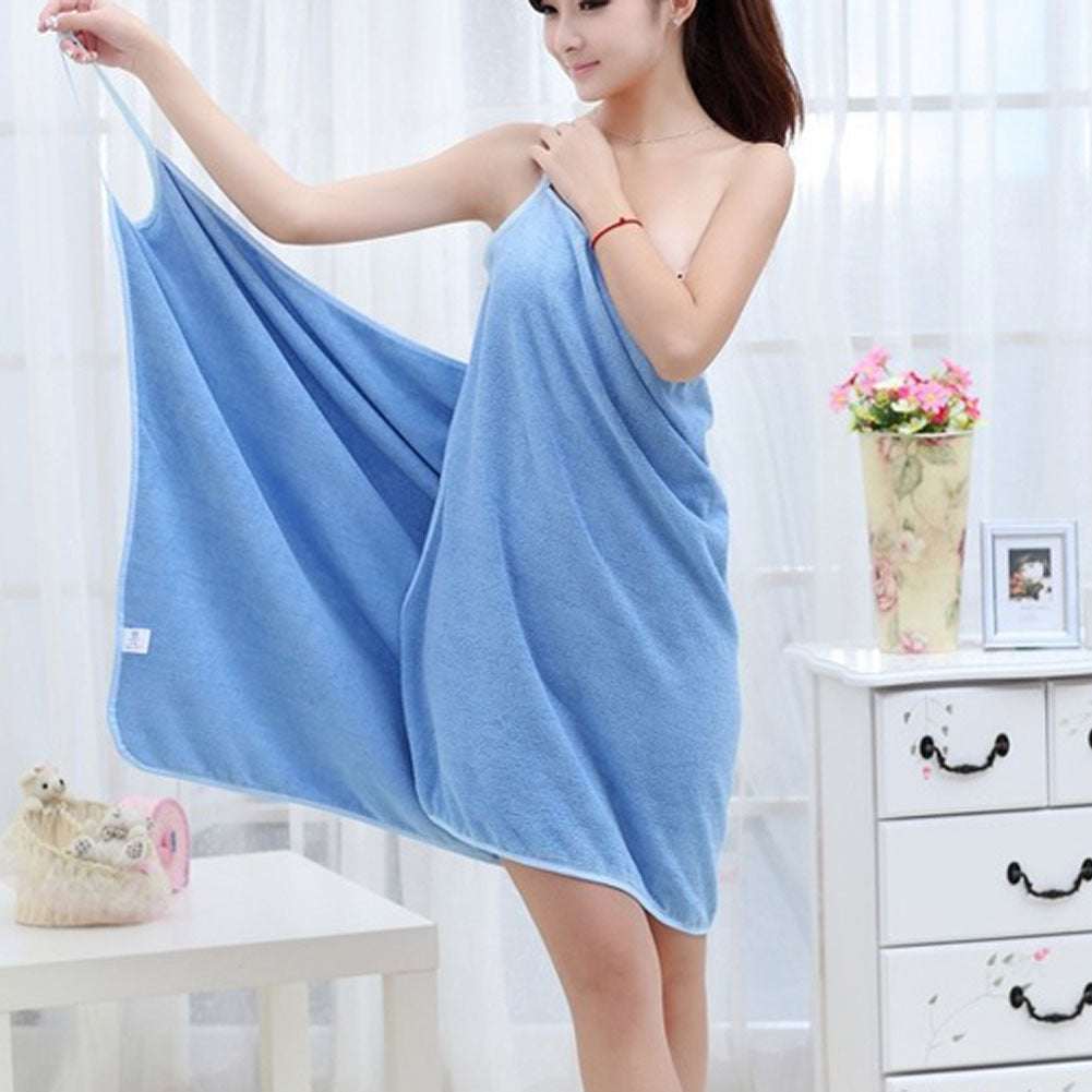 Blue beach towel styled as a bath dress, perfect for summer outings and poolside fashion.