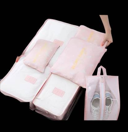Packing bags in pink waterproof material with various sizes, ideal for organized storage and travel.