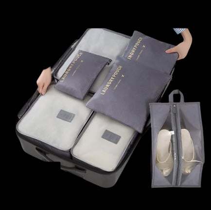 Packing bags set in suitcase, organized storage with waterproof material.