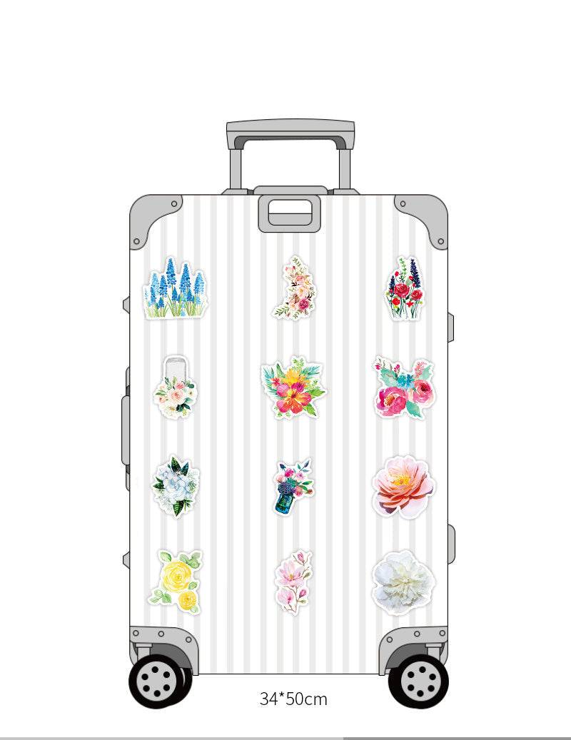 Waterproof suitcase stickers with various designs in PVC material, showcasing colorful patterns on luggage.