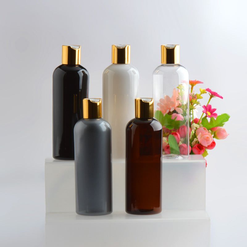 300ml hydrosol PET bottles with gold anodized caps in various colors including black, white, and brown.