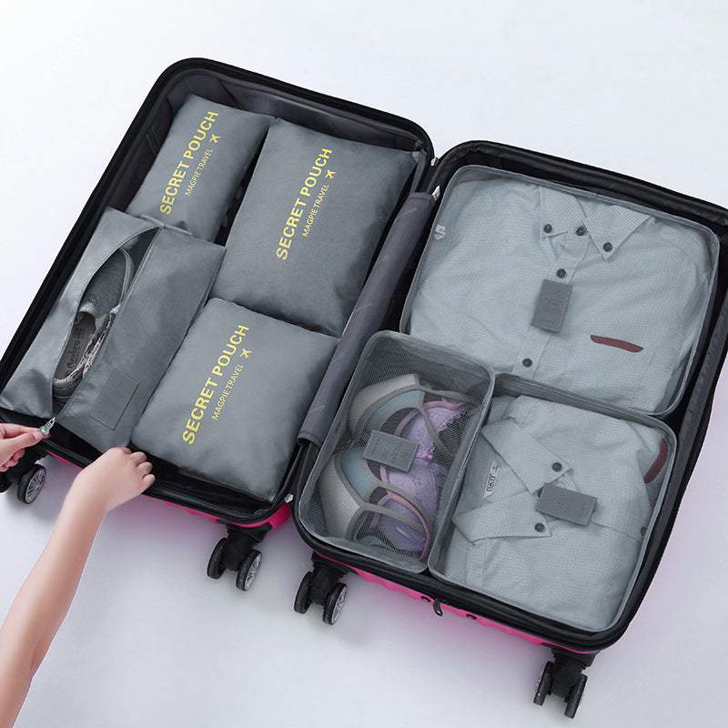 Travel luggage storage bag with organized compartments in a suitcase, ideal for clothes and accessories.