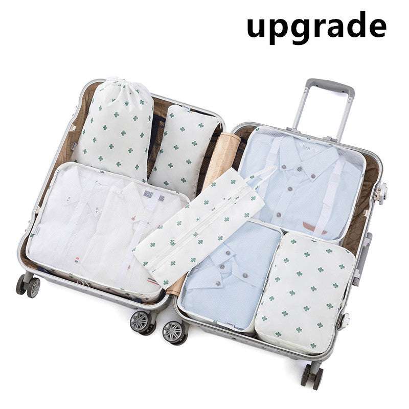 Open suitcase with multiple organized travel storage bags, made from 210D Oxford cloth for efficient packing.