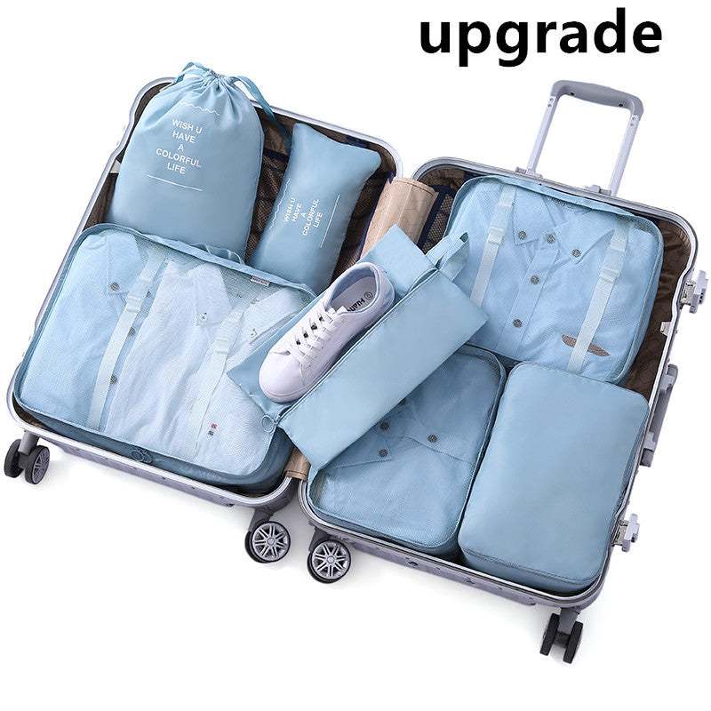 Cube-shaped travel luggage storage bag with multiple compartments in 210D Oxford cloth for organizing various items in a suitcase.