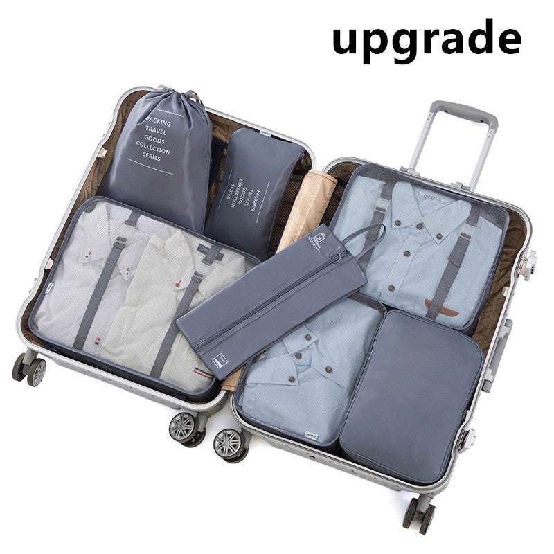 Open suitcase with organized travel storage bags in various sizes and colors, showcasing efficient packing for travel.