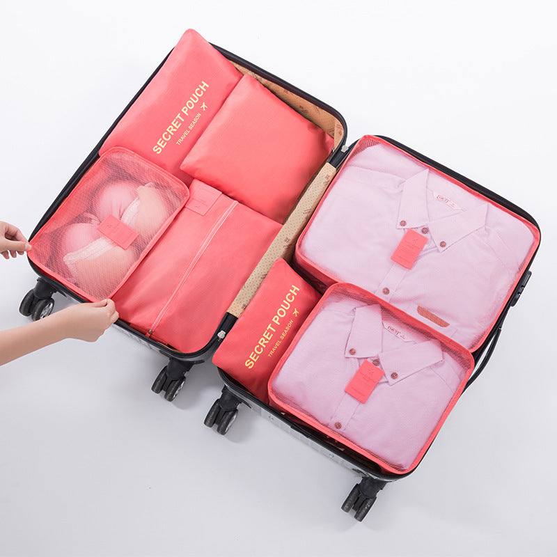 Travel Luggage Storage Bag with multiple compartments, ideal for organizing clothes and accessories in a suitcase.